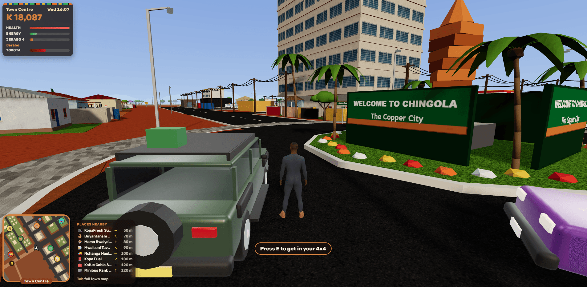 Kopala: Chola beside his 4x4 at the Welcome to Chingola sign in the town centre